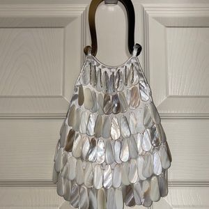 small fun purse with shiny shell details